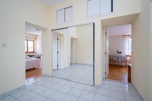 a room with glass doors and a bedroom with a bed at Triple Room Mrljane 327a in Neviđane +11 photos