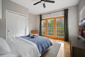a bedroom with a bed and a ceiling fan at Stay Rafa At 259 in Philadelphia