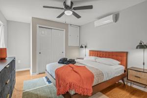 a bedroom with a bed and a ceiling fan at Stay Rafa At 259 in Philadelphia