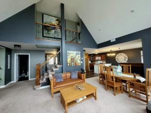 a living room with a table and a dining room at Vista Del Mare Vacation Properties in Cavendish