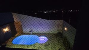 Bazén v ubytování Duplex com piscina no Grangeiro nebo v jeho okolí