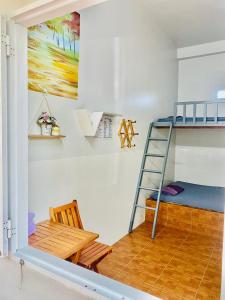 Ένα ή περισσότερα κρεβάτια σε δωμάτιο στο Co Tu's Homestay - Mui Ne