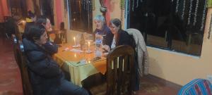 a group of people sitting around a table at Suma Uta in Copacabana +29 photos