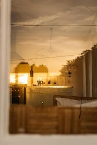 a kitchen with a sink and a stove at Ocean beach front, 3 Capes Cottage. in Eaglehawk Neck +90 photos