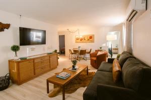 a living room with a couch and a table at Waterfront River Apartments in Rogue River