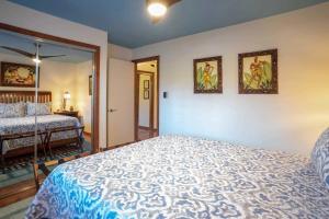 a bedroom with a king sized bed and a mirror at Tropical & Serene Ground Floor in Kihei +31 photos