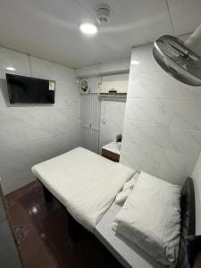 Ένα ή περισσότερα κρεβάτια σε δωμάτιο στο Mandarin Guest House