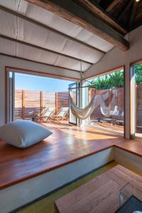 a room with a bed and a hammock on a deck at THE SECOND Kujukuri Beach House in Kujukuri +13 photos