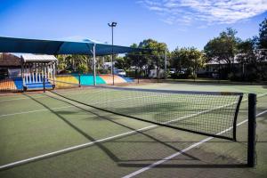 a tennis net on a tennis court at Upstairs 1 Bedroom Unit in Noosaville Resort in Noosaville