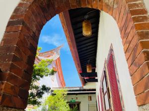 an archway of a building with two lights at Grace Kinmen B&B in Jincheng