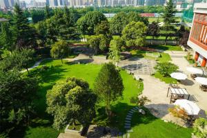 an aerial view of a park with trees and a building at Shangri-La Xian in Xi'an