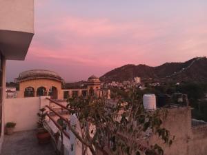 a view from the roof of a building at sunset at Cocoon Auberge in Jaipur
