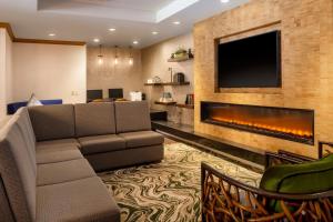a living room with a couch and a fireplace at Residence Inn Austin Downtown / Convention Center in Austin