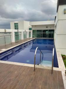 a large swimming pool in front of a building at LINDA SUITE Puerto Santa Ana GUAYAQUIL in Guayaquil
