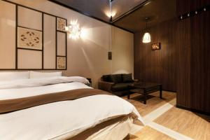 Postel nebo postele na pokoji v ubytování HOTEL GEN 福知山店