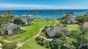 an aerial view of a house with the ocean in the background at Kiahuna Plantation in Koloa