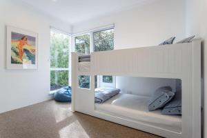 Surfs Up I Private Properties客房内的一张或多张床位
