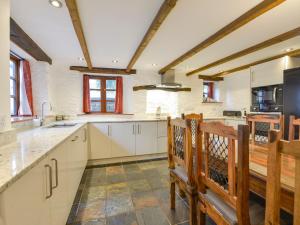 Kuchyň nebo kuchyňský kout v ubytování Samuels Cottage + 15 fotografií