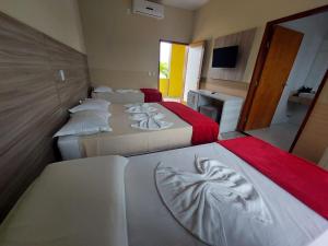 Postel nebo postele na pokoji v ubytování Hotel São Francisco