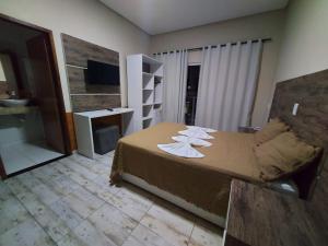Postel nebo postele na pokoji v ubytování Hotel São Francisco