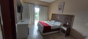 Postel nebo postele na pokoji v ubytování Hotel São Francisco