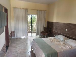 Postel nebo postele na pokoji v ubytování Hotel São Francisco