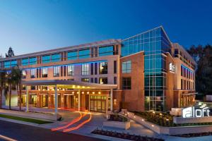 an office building with a light trail in front of it at Aloft Cupertino in Cupertino