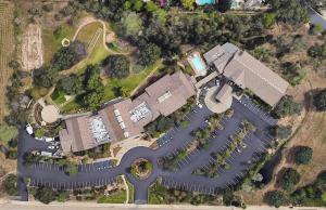an overhead view of a building with a parking lot at Rocklin Park Hotel in Rocklin