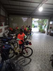 a group of people with bikes parked in a garage at Hoa Phuong Guesthouse in Ðông Hà