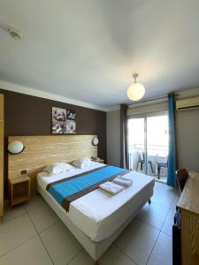 Postel nebo postele na pokoji v ubytování Hôtel Select - Réunion + 37 fotografií