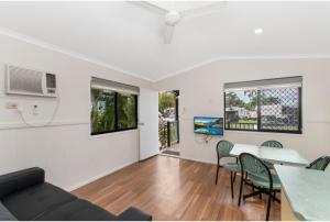 a living room with a couch and a table at Discovery Parks - Townsville in Townsville