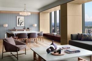 a living room with a couch and a table at The Ritz-Carlton Fukuoka in Fukuoka