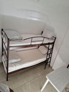 a bunk bed in a room with at Πλήρως εξοπλισμένο διαμέρισμα. in Nea Moudania