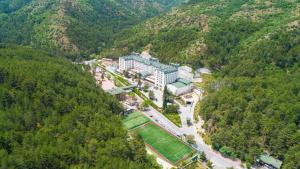 an aerial view of a building in the middle of a mountain at Cam Thermal Resort Hotel & Spa in Kızılcahamam