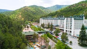 an aerial view of a resort with mountains in the background at Cam Thermal Resort Hotel & Spa in Kızılcahamam