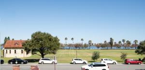 a group of cars parked in a parking lot at Central location 2 bdrm free parking and WiFi in Perth