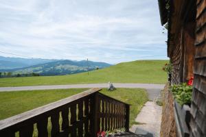 a balcony of a house with a view of a mountain at Haus Berchtold am Hüttersberg in Doren