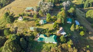 an aerial view of a house on a hill at Eagles' Rock in Underberg