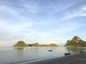 a beach with a group of islands in the water at Baan Chom Lay in Prachuap Khiri Khan