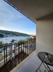 a balcony with a view of a body of water at Apartment Bety, Stomorska, Solta in Stomorska