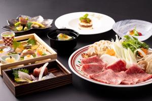 a table with plates of food on a table at Urari Takeo Garden Terrace Spa Resorts in Takeo +45 photos