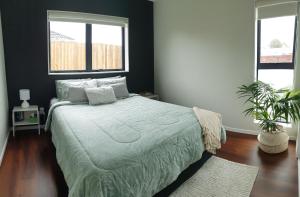 Postel nebo postele na pokoji v ubytování Humble Abode