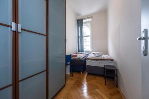 a hallway with two beds in a room at Vltava Apartments Prague 7 in Prague