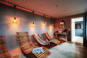 a living room with two chairs and a table at THE HEARTS HOTEL - dein Boutique- und Event-Resort in Braunlage