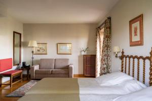 Postel nebo postele na pokoji v ubytování Parador de Verín