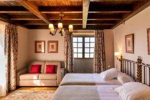Postel nebo postele na pokoji v ubytování Parador de Verín