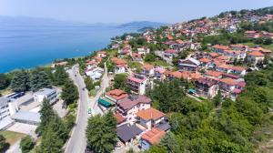 an aerial view of a town with houses and the water at DE & EV ACCOMMODATION in Ohrid