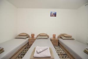Postel nebo postele na pokoji v ubytování Apartment Miske