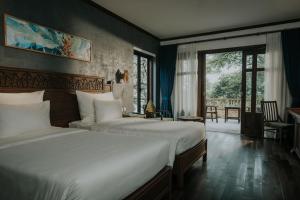 Postel nebo postele na pokoji v ubytování Amour Resort Bavi