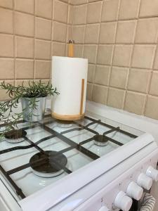 a stove top with a candle on top of it at Serene Oasis @ Arad in Arad